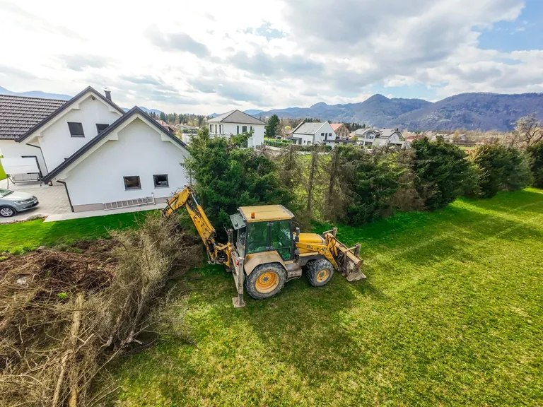 Equipment clearing brush and trees from a property